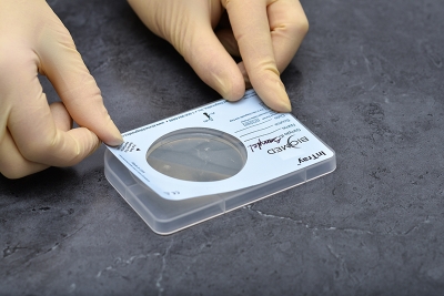 Ensure tension across the label and reattach it to the device